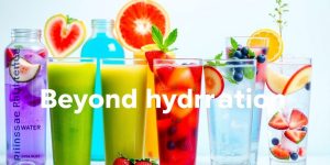 Colorful drinks in glasses with fruits and herbs.