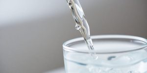 Water flowing into a glass.